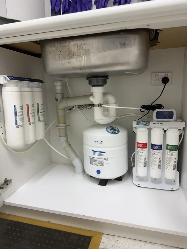 Whole-home water filtration system connected at the property's water meter